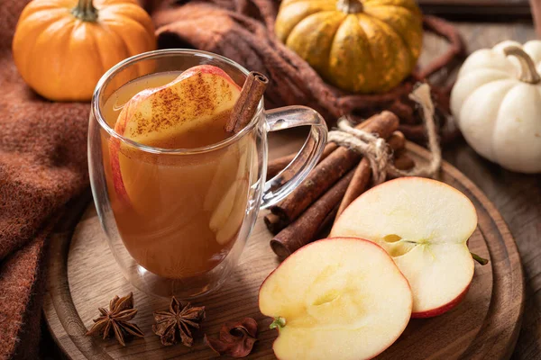 Cup Apple Cider Sliced Apples Cinnamon Wooden Platter Pumpkins Background — Stock Photo, Image