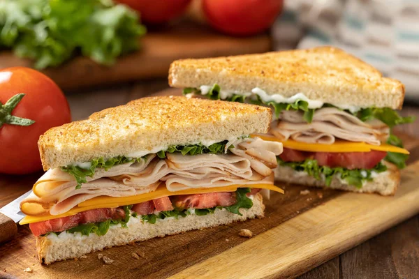 Sandwich Made Sliced Turkey Cheese Lettuce Tomato Toasted Bread Cut — Stock Photo, Image