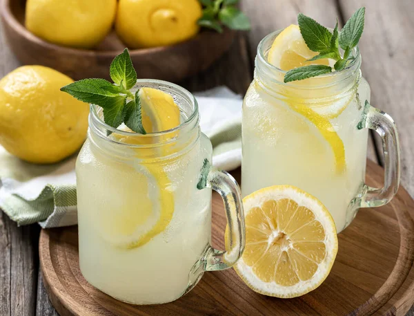 Two Glasses Lemonade Mint Lemon Wooden Tray Bowl Lemons Background — Stock Photo, Image
