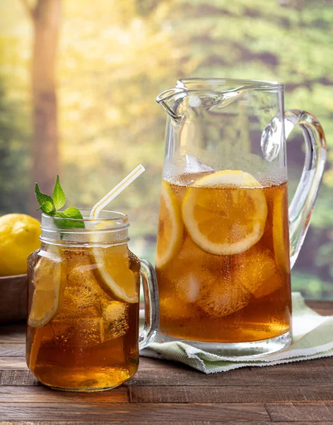 Glass Pitcher Iced Tea Mint Lemon Slices Ice Outdoor Wooden — Stock Photo, Image