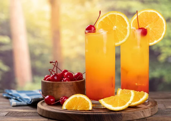 Tequila Sunrise Cocktail Orange Slice Cherry Rustic Wooden Table Rural — Zdjęcie stockowe