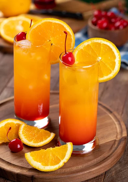 Tequila Sunrise Cocktail Orange Slice Cherry Rustic Wooden Table — ストック写真