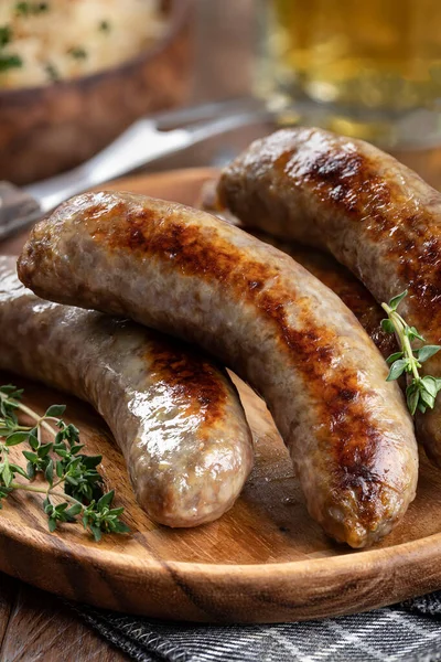 Fried Bratwurst Garnished Thyme Plate Rustic Wooden Table — Φωτογραφία Αρχείου