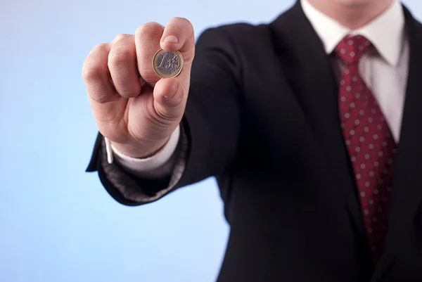 A man with one euro coin — Stock Photo, Image