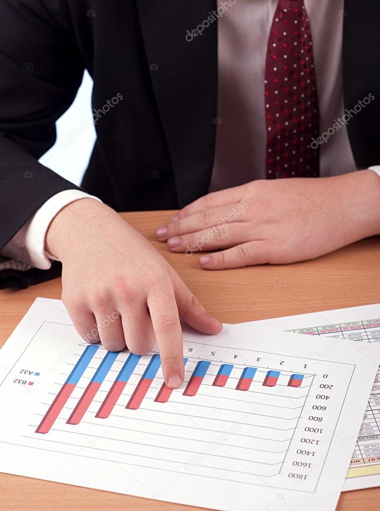 Man in suit and financial papers