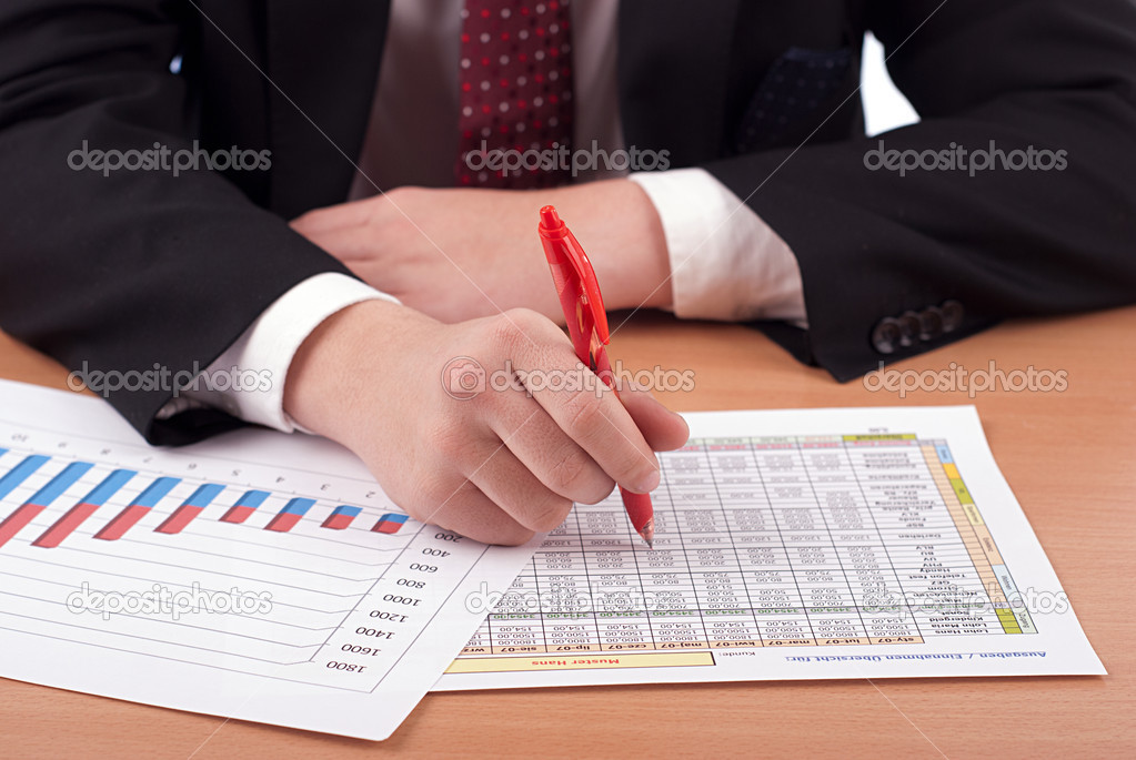 Man in suit and financial papers
