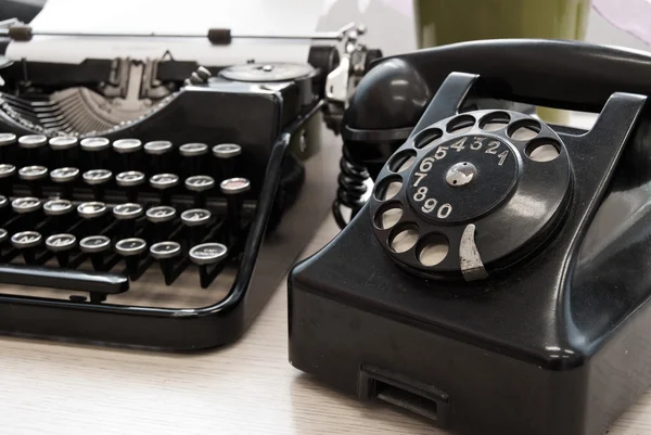 Vintage typewriter and phone — Stock Photo, Image