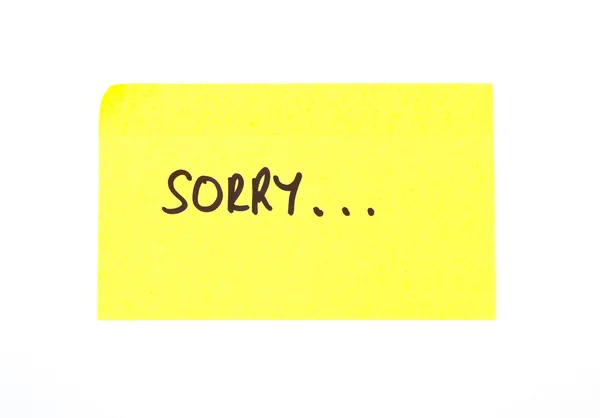 'Desculpe' escrito numa nota pegajosa — Fotografia de Stock