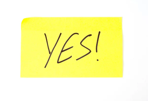 'Yes!' written on a sticky note — Stock Photo, Image