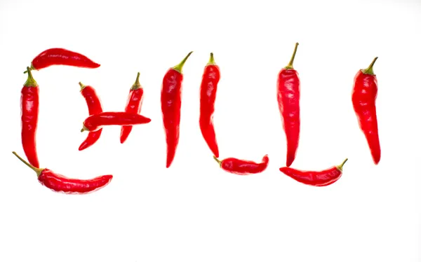 'Chilli' spelt with chilli peppers — Stock Photo, Image