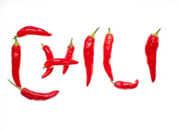 'Chili' spelt with chilli peppers — Stock Photo, Image