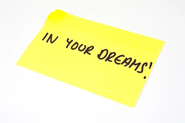 'In Your Dreams!' written on a yellow sticky note — Stock Photo, Image