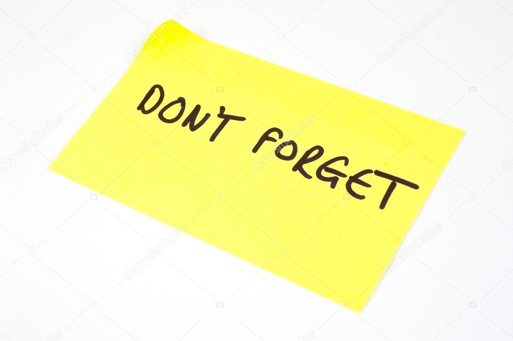 'Don't Forget' written on a yellow sticky note