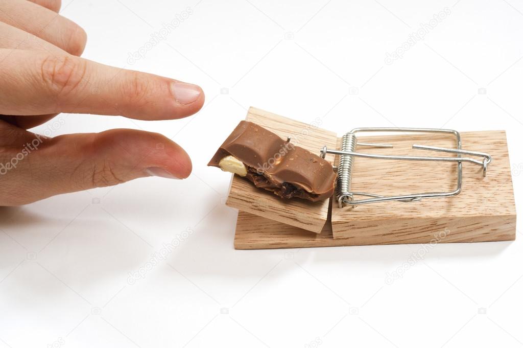 A mousetrap set with chocolate bait