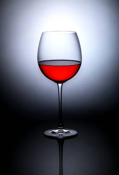 glass of red wine on a dark background