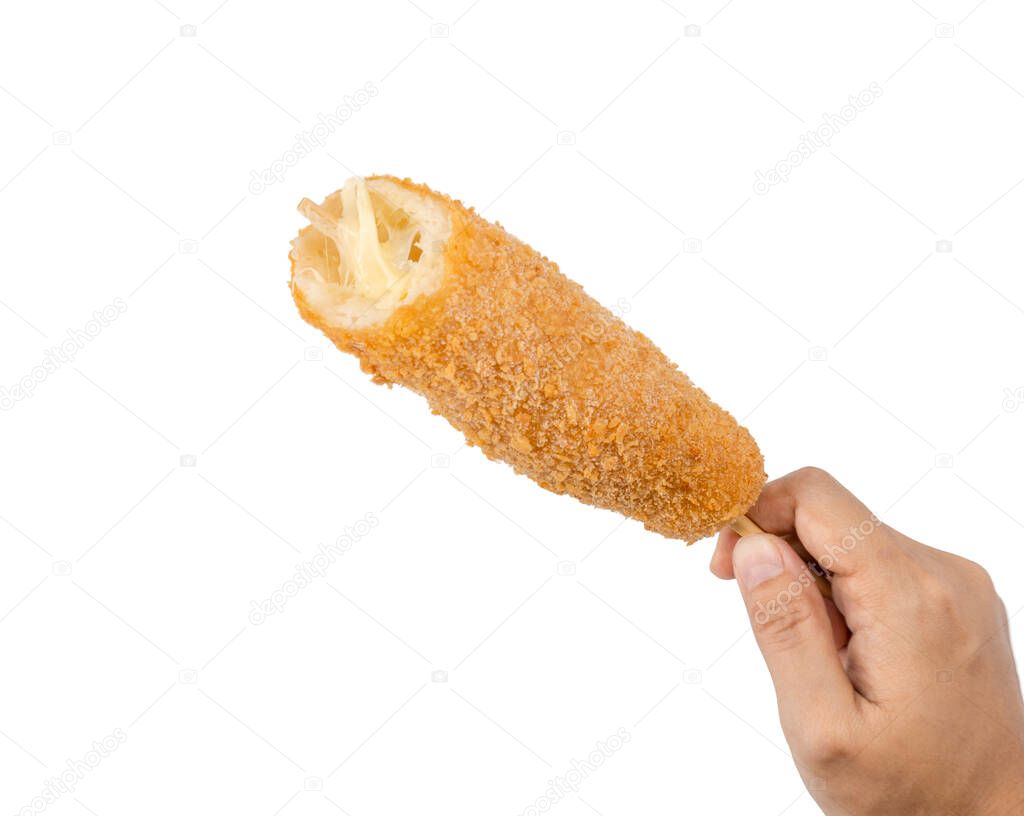 Hand-holding Korean street food corn dog is deep-fried crusted flour stuffed with sausage and cheese on a wooden skewer isolated on the white background with a clipping path.