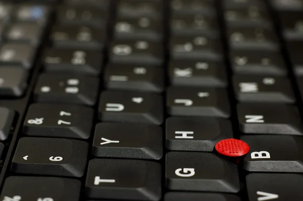 ポインティング ・ スティック赤とノート パソコンのキーボード ロイヤリティフリーのストック画像