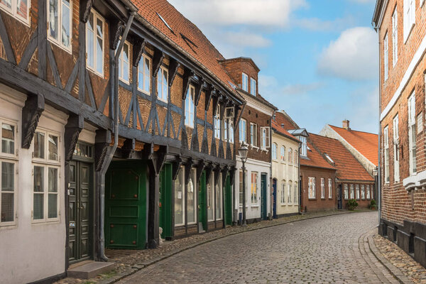 Street and traditional houses in old town of Ribe, Jutland, Denmark