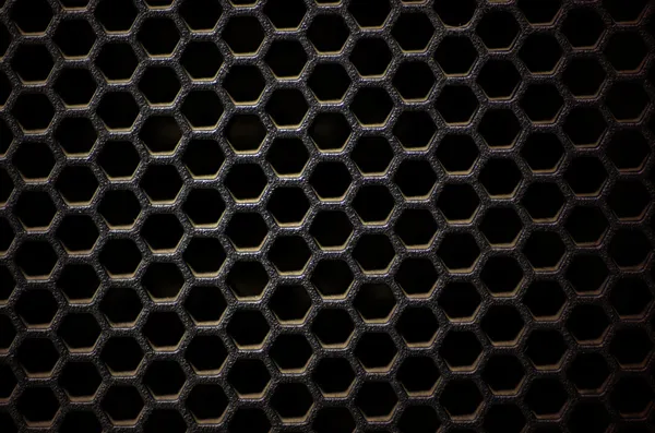 Hexagonal, honey comb stainless steel mesh on black — Stock Photo, Image