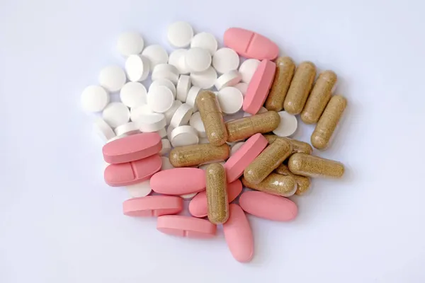 White Tablets Pink Oval Tablets Capsules White Background Food Supplements — Stock Photo, Image