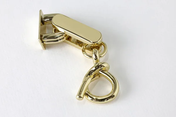 Metallic Gouden Decoratie Voor Een Tas Een Witte Achtergrond Decoratie — Stockfoto