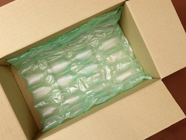 Polyethylene Air Green Bubble Wrap Brown Cardboard Box Top View — Fotografia de Stock