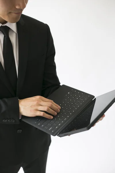 Business man standing with tablet — Stock Photo, Image