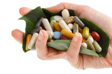 Hand with pills clipart