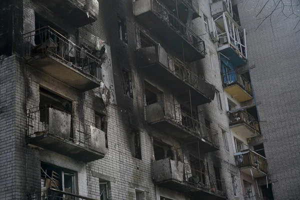 Ruined house without windows. Burnt house after shelling during the war