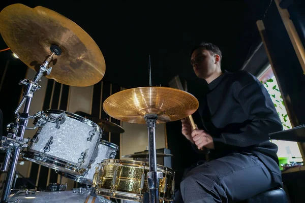 Drummer Sits Drum Set Plays Holds Drumsticks His Hands — стоковое фото