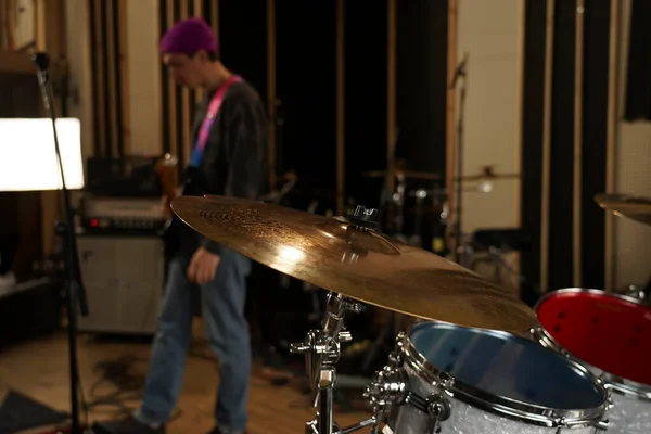 High-hat and crash cymbal close-up in the studio. Drum kit