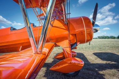 historical biplane on a meadow