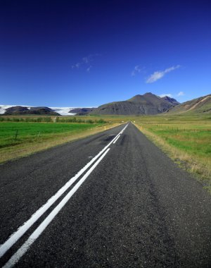 Straight road to the glacier clipart