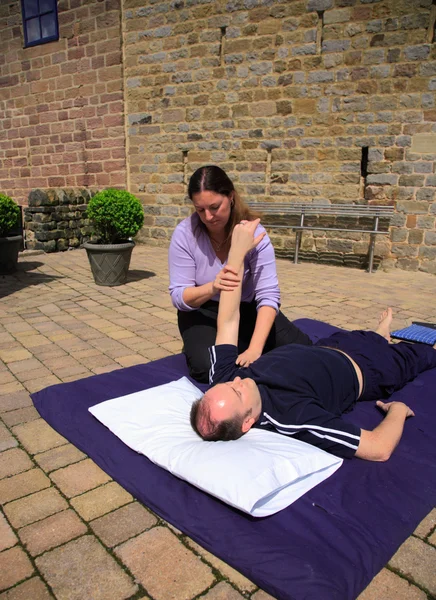 Stretching of the shoulder — Stock Photo, Image