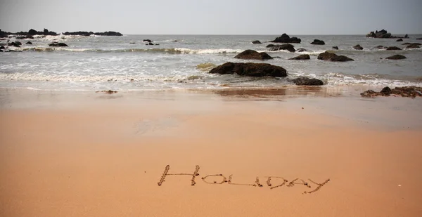 Holiday written in the sand — Stock Photo, Image