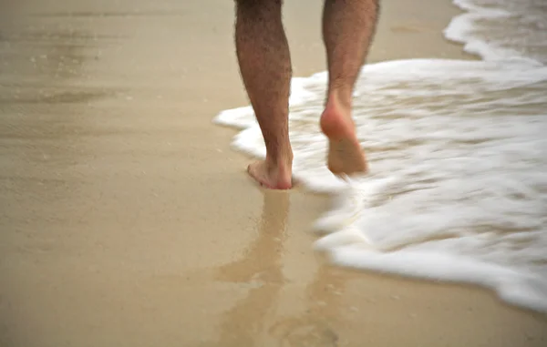 Man strolling through the surf — Stock Photo, Image
