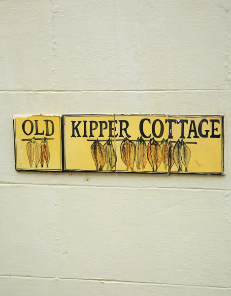 Sinal velho da casa de campo de Kipper Imagem De Stock