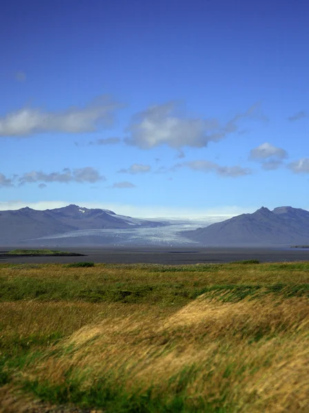 Meadow and glacier Stock Photo