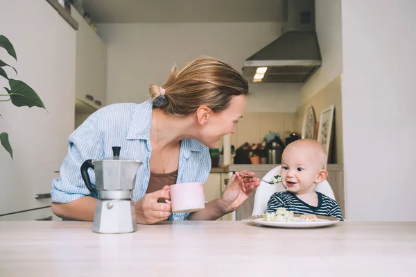 Loving Smiling Mother Baby Son Eating Breakfast Have Fun Kitchen — Stock Photo, Image