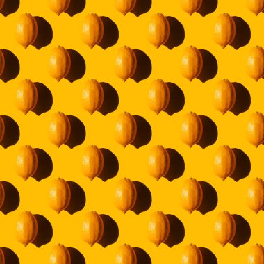 seamless lemon pattern with a hard shadow on a yellow background