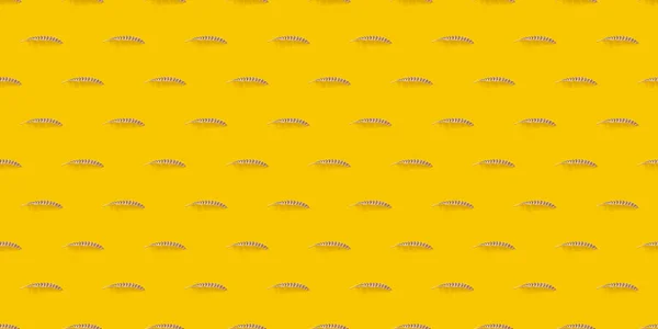 Seamless feather pattern with hard shadow on yellow background — Foto Stock