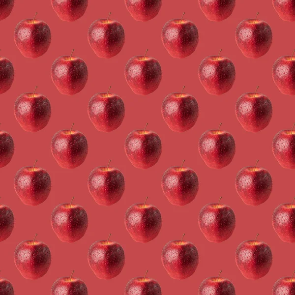 Patrón sin costuras manzana roja sobre fondo rojo —  Fotos de Stock