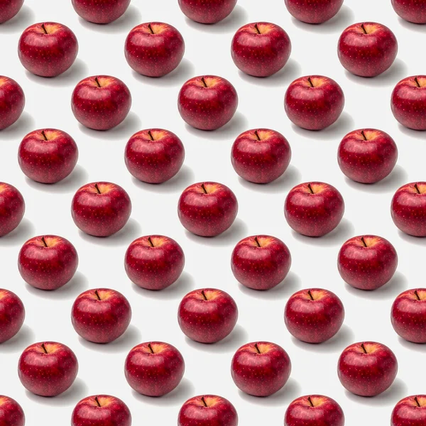 Padrão sem costura de maçãs vermelhas em um fundo branco — Fotografia de Stock