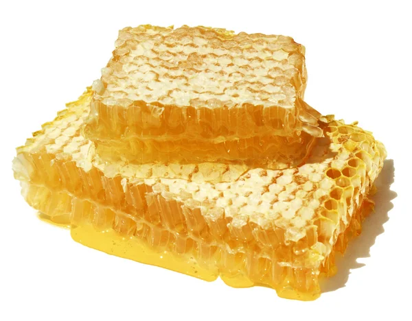 Primer plano panal con gotas de miel fresca . Imagen de archivo