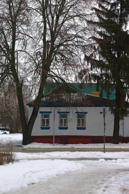 old house  on snowy street of the small town