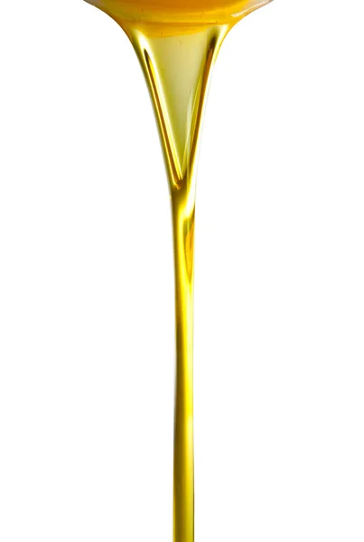 Pouring oil or golden liquid. — Stock Photo, Image