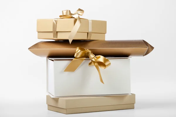 Gift boxes with golden ribbon — Stock Photo, Image