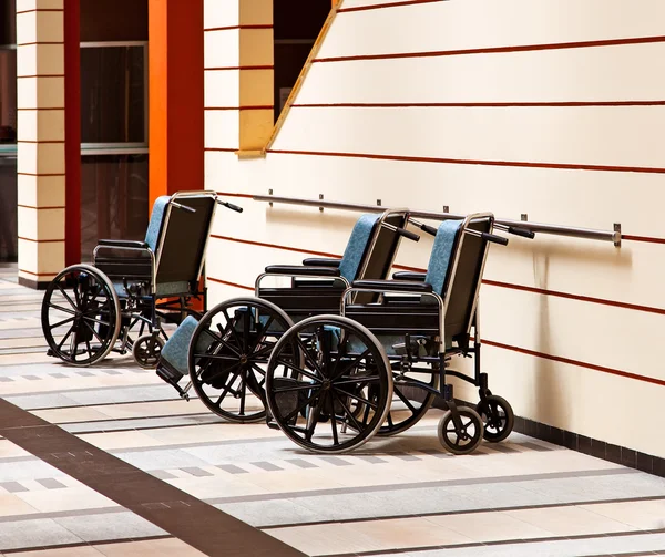 Disabled elderly in a wheelchair in the room Stock Photo by