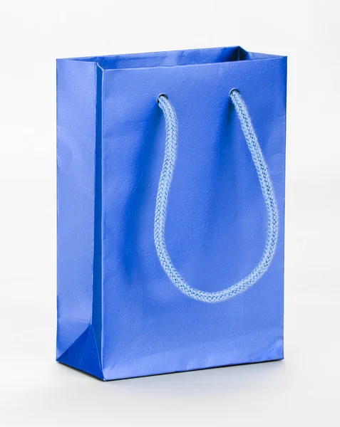 Um saco de compras azul . — Fotografia de Stock