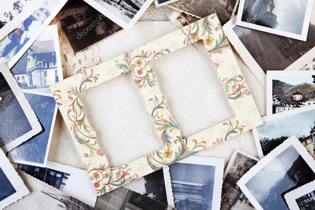 A pile of old photographs with space for your logo or text.